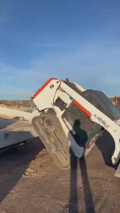 This Track Loader unloading