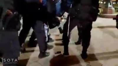 A lone protester shouts "Peace to Ukraine, Putin to The Hague" in central Moscow's Pushkin Square and is lifted off the ground and dragged away by at least seven cops.