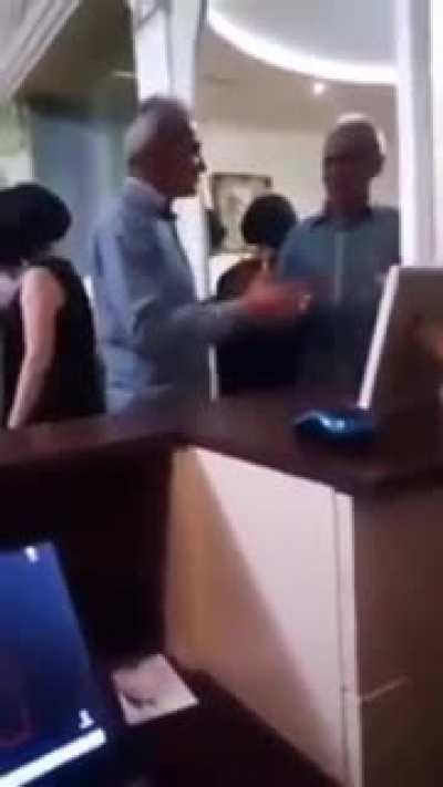 Drunk guy arguing with himself on mirror