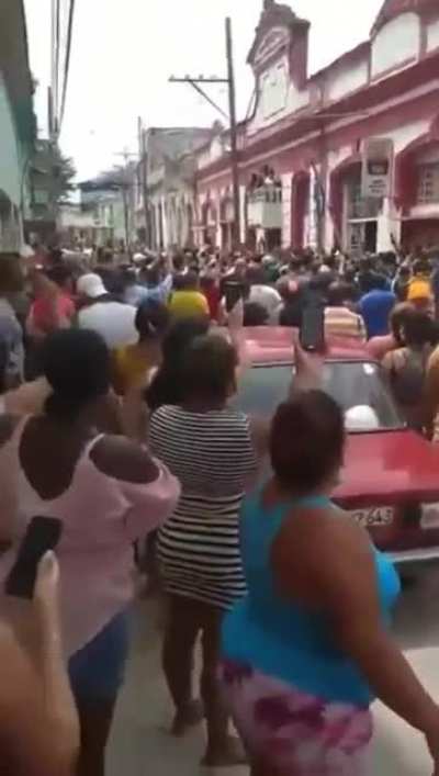 Protestors in front of the Cuban Communist Party Headquarters chanting "Cuba isn't yours!"