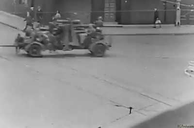 Amazing to see how people seem to be going about their business while German forces start to retreat from Antwerp in 1944. Vehicles, armor, artillery and wounded evacuating.