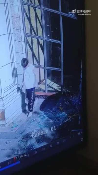 Kid kicking open a glass door.