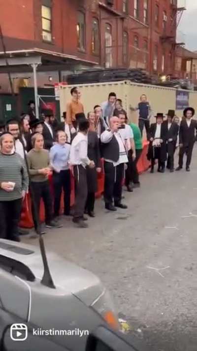 "Orthodox Jewish children throw chicken eggs and water at animal care protesters." (not oc)