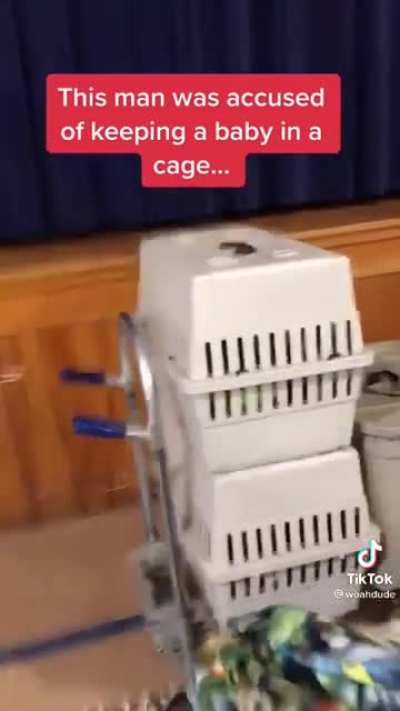 Crying baby in a cage