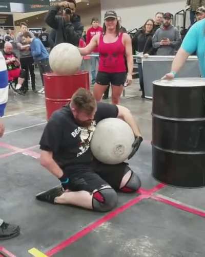 Handicapped man doing the Atlas Stones at Arnold Schwarzenegger&rsquo;s Disabled Strongman competition