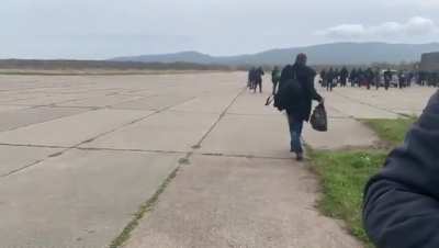 Ru pov: in far East of Russia, mobilization is underway. One recruit is seen stumbling around and another fell asleep in the bushes