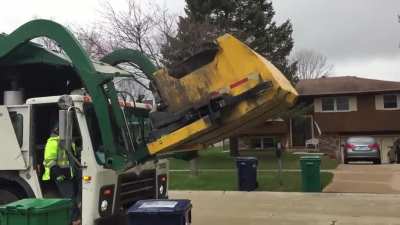 This unique garbage truck has a special feature