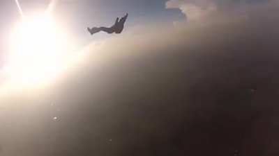 Two skydivers collide mid-air, knocking one of them unconscious. Camera man proceeds to pull some mission impossible shit and saves his life.