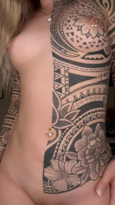 Jumping up and down with tatted tits makes for a mesmerizing combo