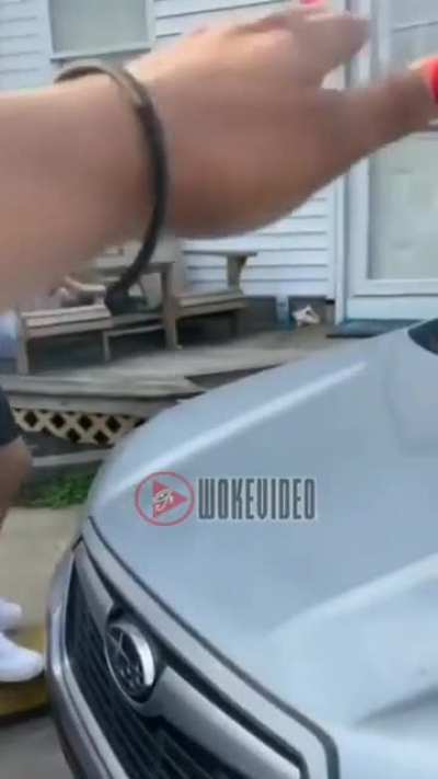 Confrontational woman spits during parking dispute