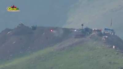 Kurdish fighters firing an atgm at Turkish position (pretty sure it's a tank, can't say for sure)