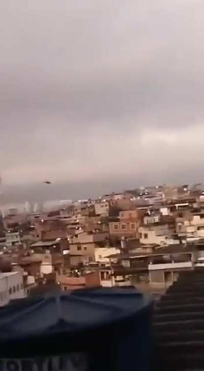 Brazil, Complexo do Alem&atilde;o, a favela in Rio de Janeiro, heavily armed criminal shoots at a police helicopter