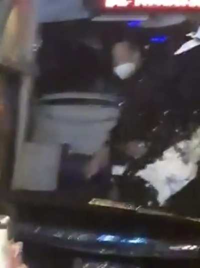 Diego Simeone taunting a crowd of Real Sociedad fans as they attack the Atletico Madrid team bus