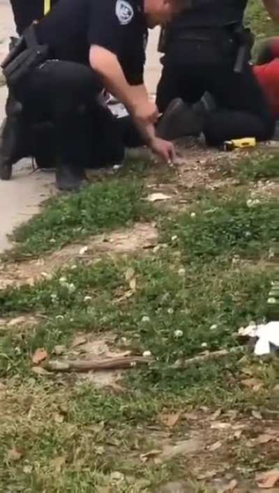 Cop is caught on camera planting evidence, attacks kids who are recording him when he realizes