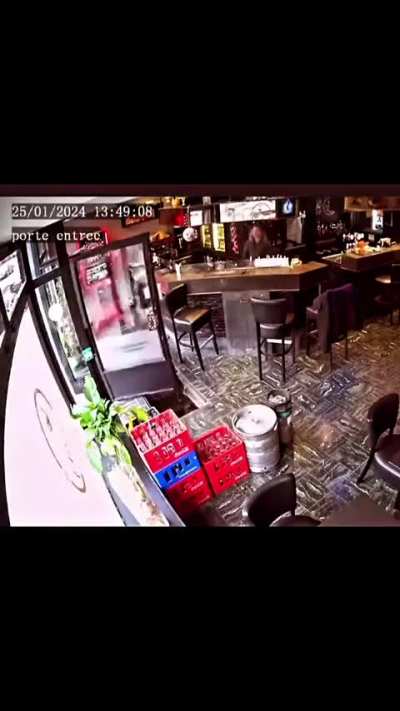 Lady falls into a hole while entering a caf&eacute;. Belgium