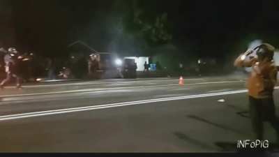 Rioters throw Molotovs at Each Other