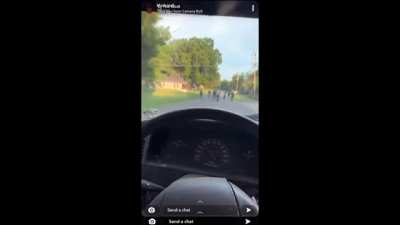 Man nearly runs over black children in the street while using racist language