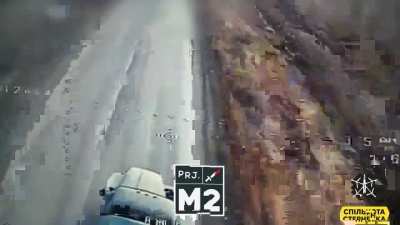 Footage of a "long drone" FPV engaging russian Ural truck
