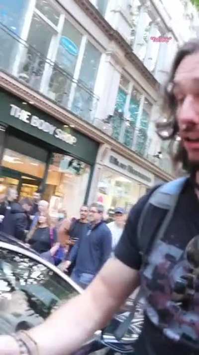 Tiktoker eats burger Infront of vegans