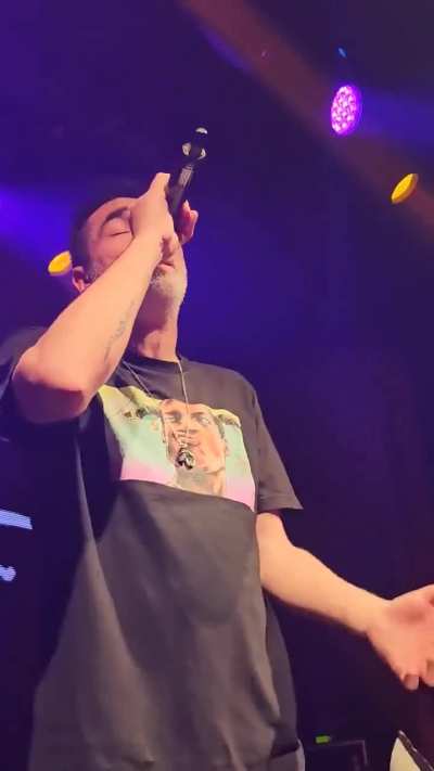 Singer on stage, gets a "gift" thrown at him!!