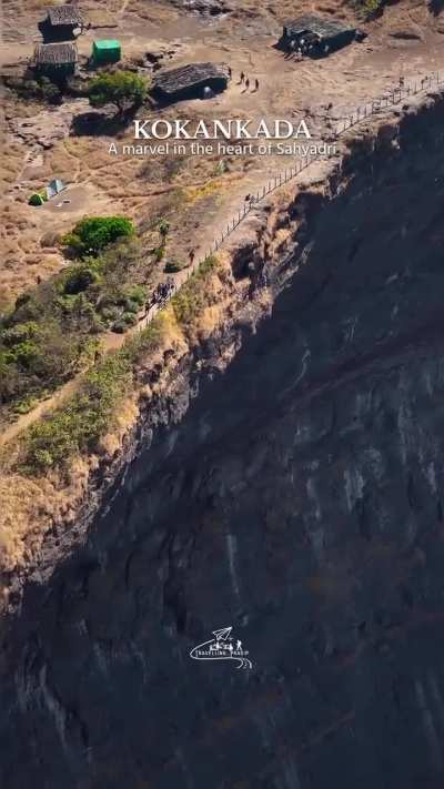 A semicircular overhanging cliff in Maharashtra, India.