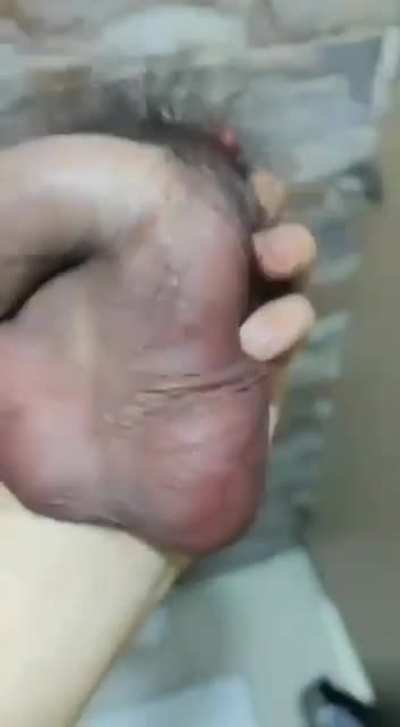 Woman holding a severed penis.