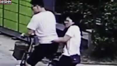 Guy kick kid because he hit his girlfriend with a football!