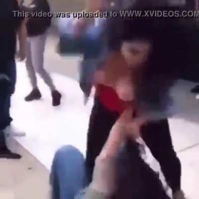 Big tits plop out in a fight