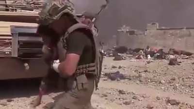 Soldier runs into firefight to save a child.
