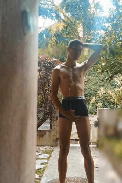 Shirtless young guy in underwear can't contain the piss outside !