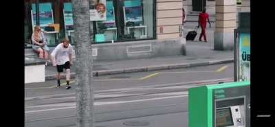man jumping over wall into water.
