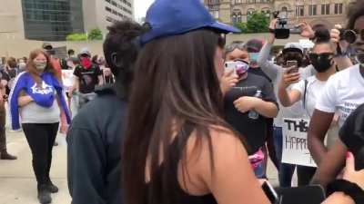 Man in black face showed up to the Toronto protest. He was later arrested.