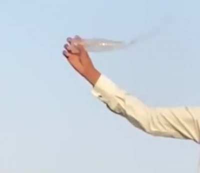 Open a bottle of water by AK-47.