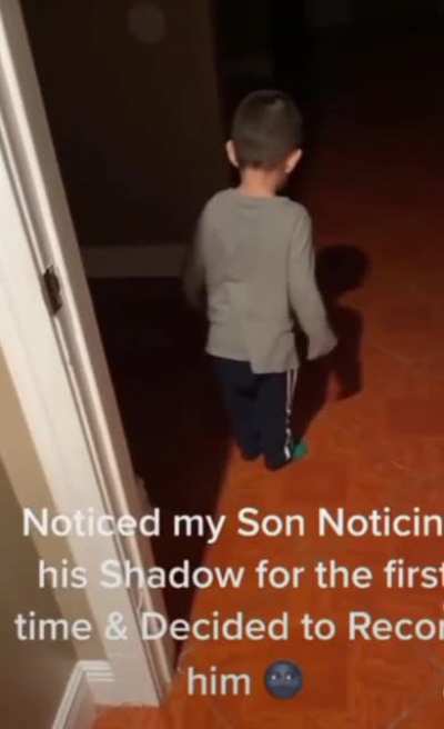 The kid discovered a shadow for the first time.