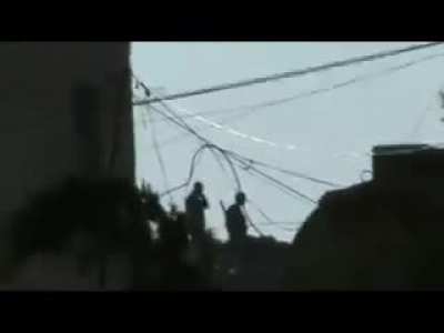 Early-war FSA fighters take pot shots at a pair of SAA soldiers standing watch - 2012