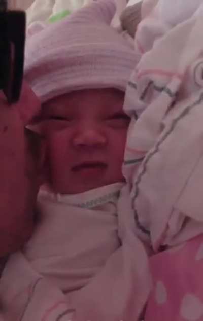 4 hours old and we caught her first &ldquo;smile&rdquo; on camera.