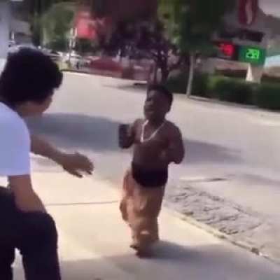 Midget gang member making sure people respect his gang