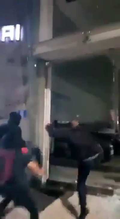 Protesters x Window