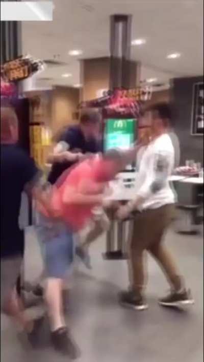 Two gentlemen receiving a McBeating