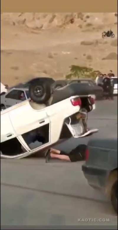 Imbecile sits out of a drifting car&rsquo;s window and eats pavement. This is rough.