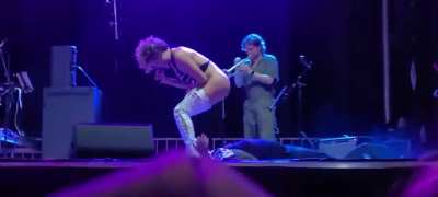 "Brass Against" singer urinates on fan live onstage in Daytona