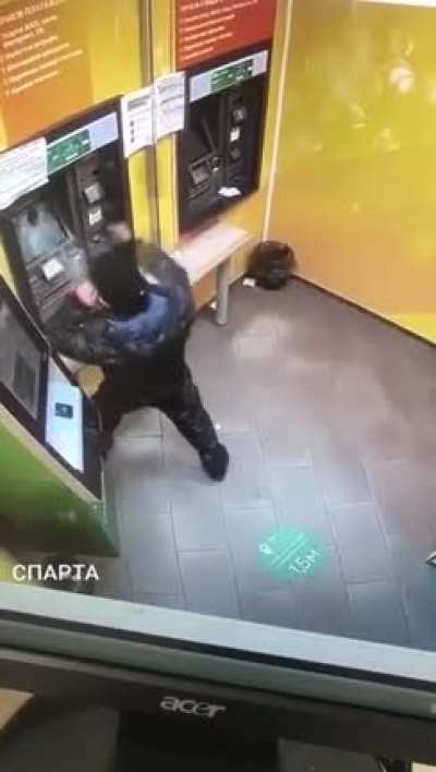 Angry dude takes on ATM with a frying pan.