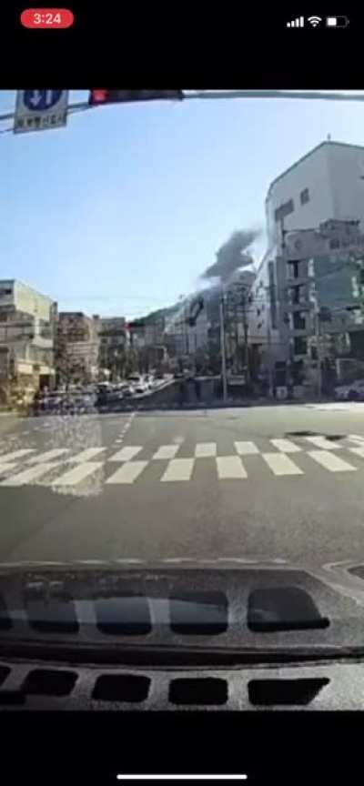 Car plummets off parking garage