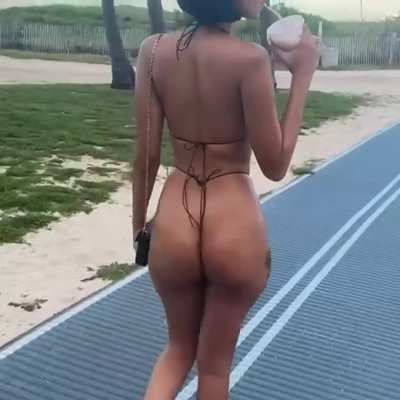 Edwina Carla Isaacs walking path in string bikini