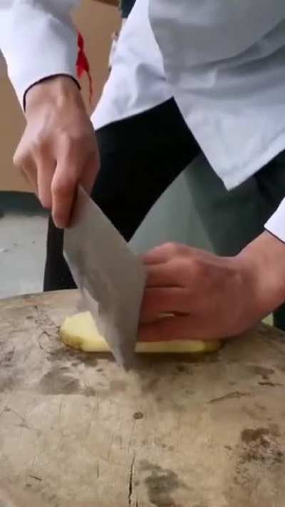 Cutting a potato (sound on)