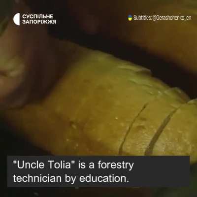 Uncle Tolia feeding the First Tank Artillery division. "Fresh air, delicious food is everything a real Cossack needs"