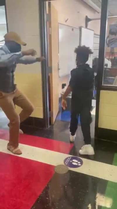 "You don&rsquo;t have to physically touch a child to actually &ldquo;touch&rdquo; a child." - teacher does socially distanced custom greetings to motivate his students