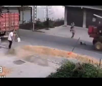 Kid almost gets wrecked by a tractor!