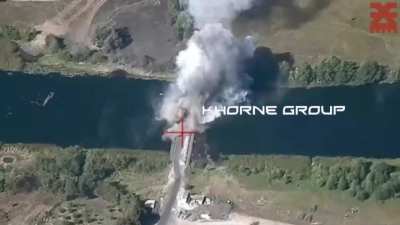 Drone footage by the Ukrainian "Khorne group" shows another attack on a russian bridge over the Seym river. Near Karyzh, Kursk Oblast, russia.