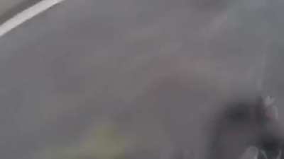 Dude lays down his motorcycle in the rain, immediatly protects the passenger